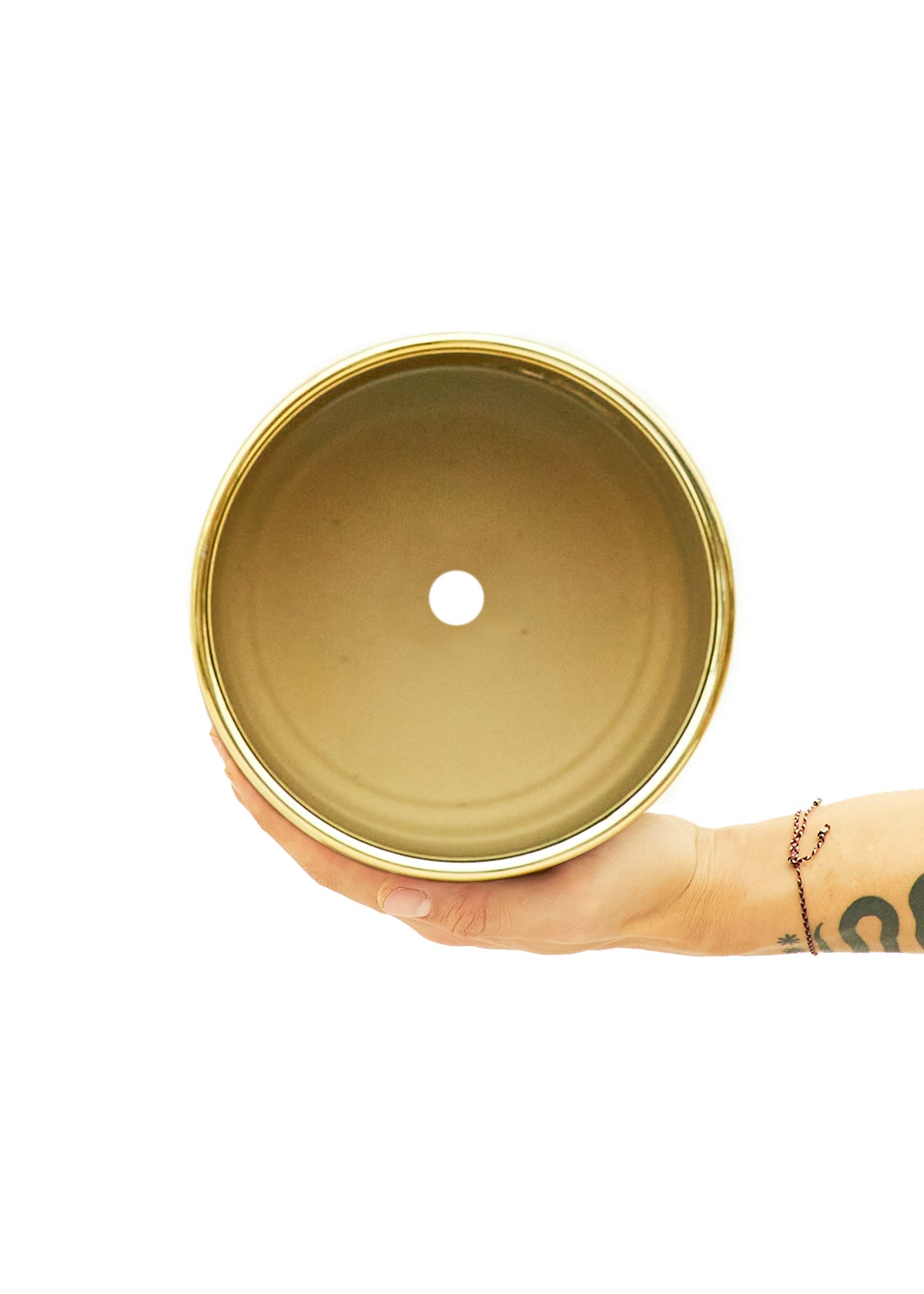 Shiny Gold Cylindrical Ceramic planter 5" wide with a white background with a hand holding it to view the top 